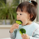 child eating broccoli